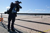 New York Daily News photographer Todd Maisel shooting a crime scene at Coney Island. 